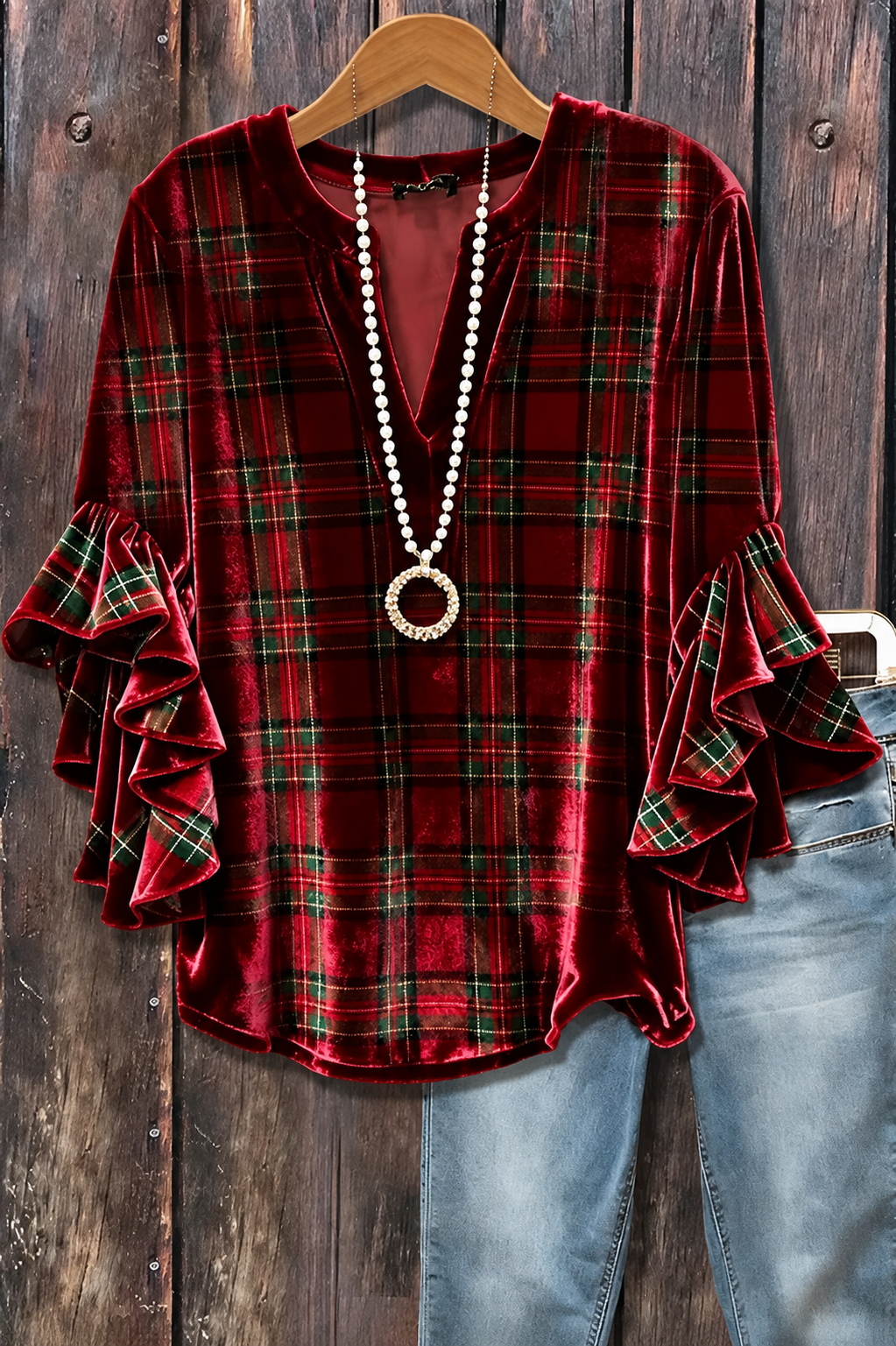 Burgundy tartan plaid split neck top with cascading ruffle sleeves, styled with a necklace and jeans